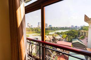 a view of a river from a balcony at Artisan Lakeview Hotel in Hanoi