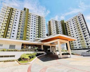 a building with a gazebo in front of it at SoSe's Crib at Mesaverte Garden Residences in Cagayan de Oro