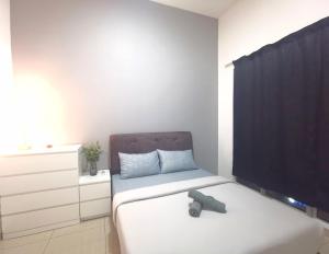 a small bedroom with a bed and a tv at Austin Manhattan 1BR Johor Bahru by Maco Home in Johor Bahru