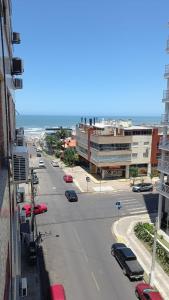 an aerial view of a city street with cars parked at Torres a mais bela praia gaúcha in Torres