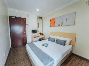 Postel nebo postele na pokoji v ubytování Hotel 81 Joy