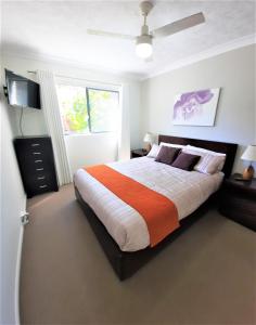 a bedroom with a large bed and a window at Luxury Residence Turtle Bay Resort in Gold Coast
