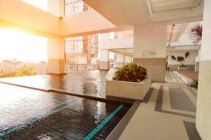 a building with a pool in the middle of a building at JB Twin Galaxy Residence near KSL Mall and NewYorkHotel in Johor Bahru