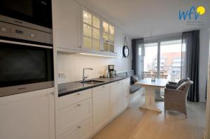 Kuchyň nebo kuchyňský kout v ubytování Achterhus - Ferienwohnung Inseltraum + 20 fotografií