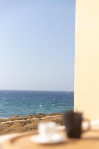 a table with a view of the ocean at Almi of Naxos in Naxos Chora
