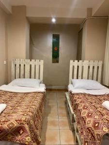 Postel nebo postele na pokoji v ubytování Mini Hostel N.Tigranyan 5