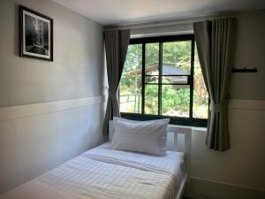 Postel nebo postele na pokoji v ubytování Island House Rentals 26