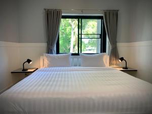 Postel nebo postele na pokoji v ubytování Island House Rentals 26