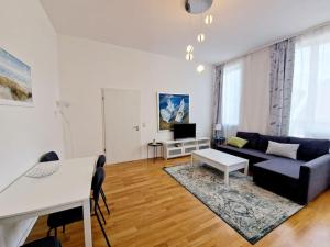 a living room with a couch and a table at Luxury apartament in the heart of Berlin 45 in Berlin
