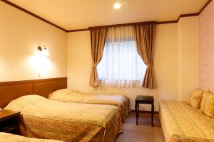 Postel nebo postele na pokoji v ubytování Heidihof Hotel