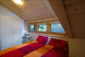 Ένα ή περισσότερα κρεβάτια σε δωμάτιο στο Chalet Terme Bormio