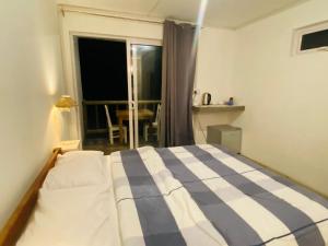 Postel nebo postele na pokoji v ubytování Kite Room