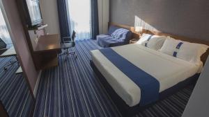 Posteľ alebo postele v izbe v ubytovaní GP Hotel