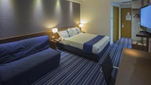 Posteľ alebo postele v izbe v ubytovaní GP Hotel