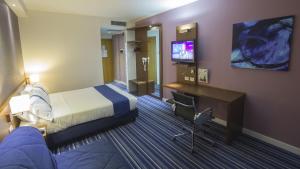 Televízia a/alebo spoločenská miestnosť v ubytovaní GP Hotel