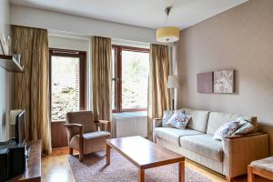Posezení v ubytování Ylläs Saaga Ski Chalets 2