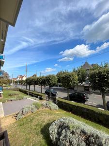 a view of a parking lot with cars parked at Jed YourHostHelper in Ouistreham