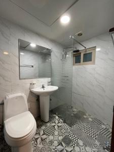 a bathroom with a toilet and a sink at Ssangma Motel in Busan +16 photos