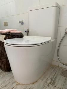 a white toilet in a bathroom with a sink at Mazarita Beach Residence in Sharm El Sheikh