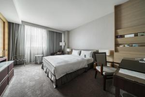 Postel nebo postele na pokoji v ubytování Taipung Suites + 37 fotografií