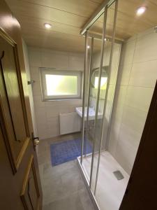 a bathroom with a shower and a sink at Ferienhaus Gandle in Kappl