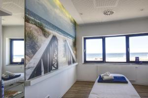 A bed or beds in a room at aja Warnemünde