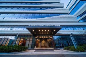 an office building with a large building at Howard Johnson by Wyndham Lanting Hotel Ningbo in Ningbo