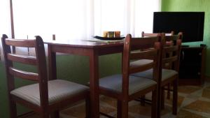 A television and/or entertainment centre at Nefelejcs Apartman