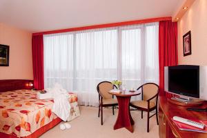 Postel nebo postele na pokoji v ubytování Hotel Balneolum Superior + 37 fotografií