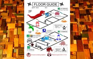 a poster of the floor guide with woodcuts at Hostel Oomori Souko in Tokyo