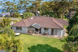 an aerial view of a house with a yard at Two Dreamy Properties In One in Culburra Beach