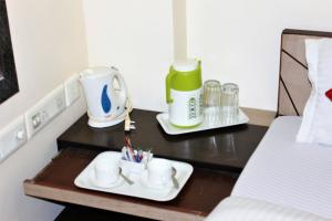 Postel nebo postele na pokoji v ubytování Reliable Inn