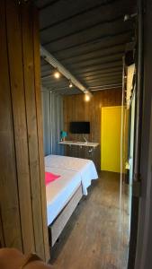 Ein Bett oder Betten in einem Zimmer der Unterkunft Capim Limão Village do Rosa