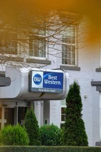 a best western sign in front of a building at Best Western New Kent Hotel in Newcastle upon Tyne