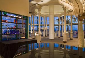 a view of a building with a reflection in the water at Hyatt Regency Long Beach in Long Beach