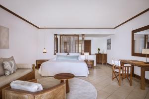 Krevet ili kreveti u jedinici u okviru objekta Paradis Beachcomber Golf Resort & Spa