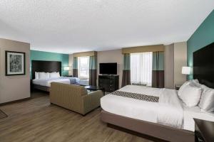 a hotel room with two beds and a television at La Quinta by Wyndham Lebanon in Lebanon +31 photos