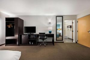 a hotel room with a desk and a chair at Sleep Inn & Suites Cullman I-65 exit 310 in Cullman