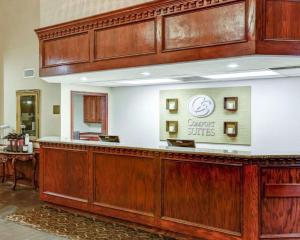 a lobby with a counter with a sign that reads cancer suites at Comfort Suites Idabel in Idabel
