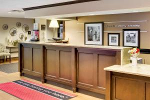 a large lobby with a reception counter and a waiting room at Wingate by Wyndham Cranberry in Cranberry Township