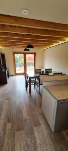 a dining room with tables and chairs in a room at Lomas Schuss ARG41 in San Carlos de Bariloche