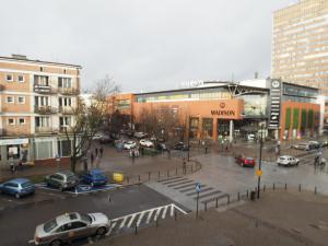 a city with cars parked in a parking lot at Gama K2124 Grand-Tourist Apartments in Gdańsk