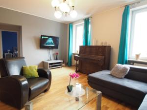 Televízia a/alebo spoločenská miestnosť v ubytovaní Gama K2124 Grand-Tourist Apartments