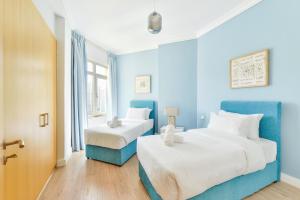 Postel nebo postele na pokoji v ubytování Shoreline · Beachfront Luxury Palm Jumeirah · Free 5* Beach Resorts Access