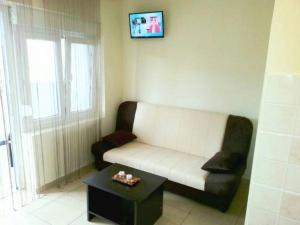 a living room with a couch and a coffee table at Apartment in Tribunj with terrace, air conditioning, WiFi 5038-2 in Tribunj