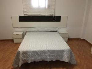 Postel nebo postele na pokoji v ubytování Vivienda con Fines Turísticos Salvador