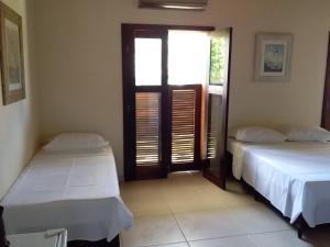 Voodi või voodid majutusasutuse Residencial Seestern - Suítes toas