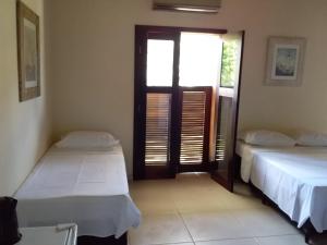 Voodi või voodid majutusasutuse Residencial Seestern - Suítes toas