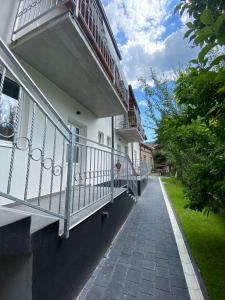 a balcony of a house with a walkway at Bumerang in Soko Banja