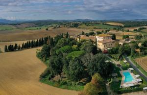 an aerial view of a house in a field at Villa Sabolini in Colle Val D'Elsa